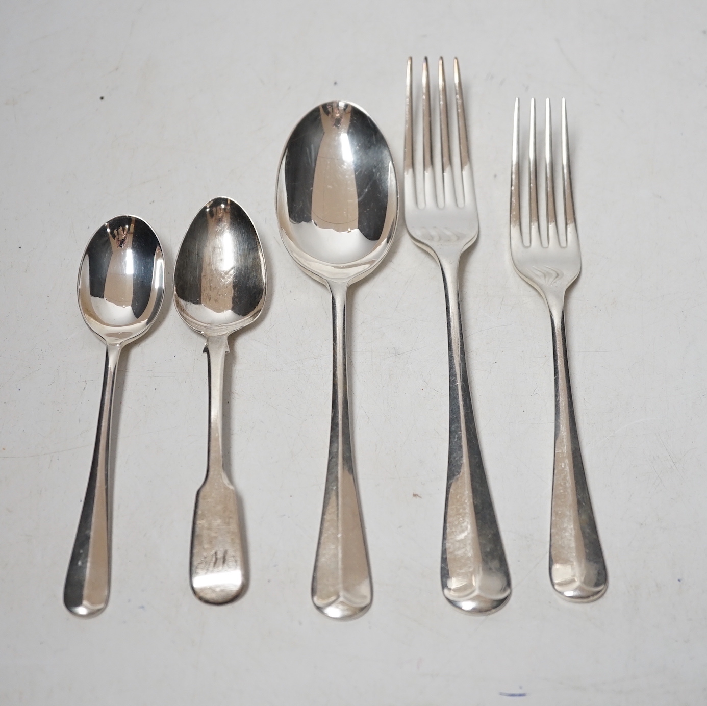 A modern canteen of silver Hanovarian rat tail pattern cutlery for six, by Payne & Son, Sheffield, 1994, comprising forty four items, including silver handled steel dessert and table knives and one earlier fiddle pattern